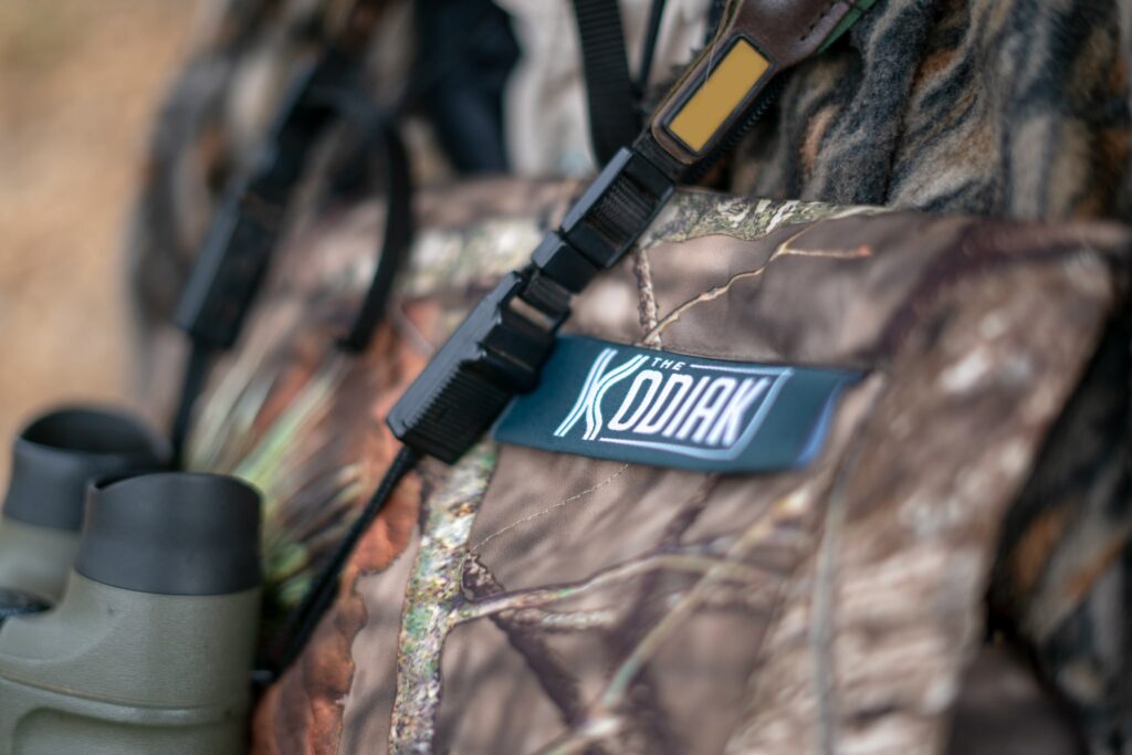 Binoculars and the Mossy Oak Break Up Country Kodiak Battery Powered Heating Blanket